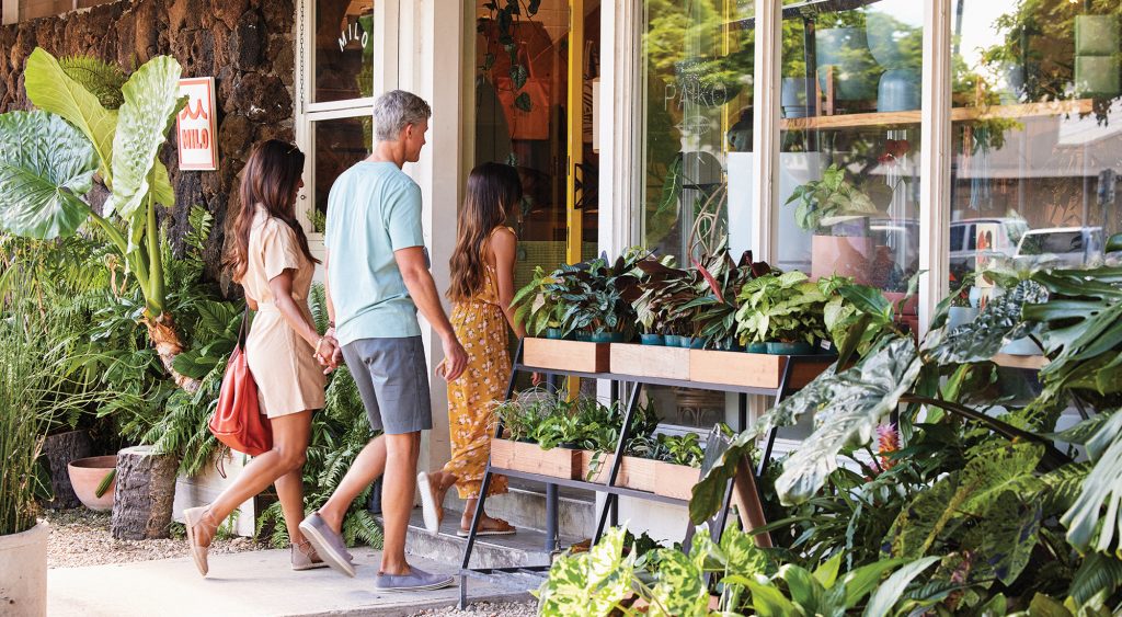 Family walking into shop at Alia